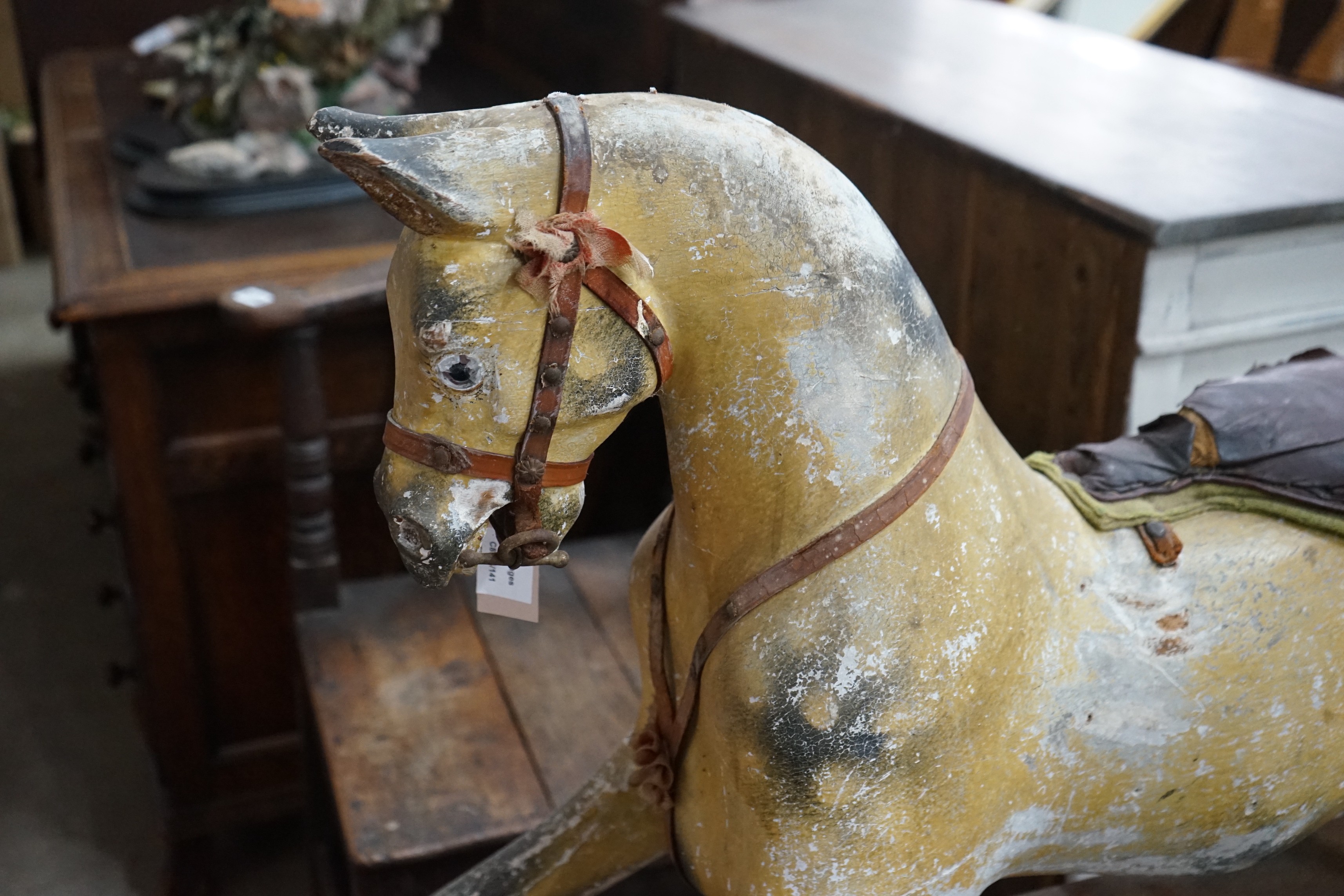 A vintage Tri-Ang rocking horse on pine safety frame, length 132cm, height 112cm